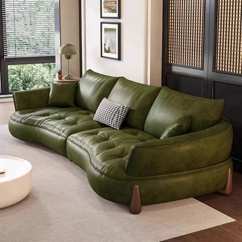 High back with overfilled cushions – design of sofa + living room couch + leather + olive green