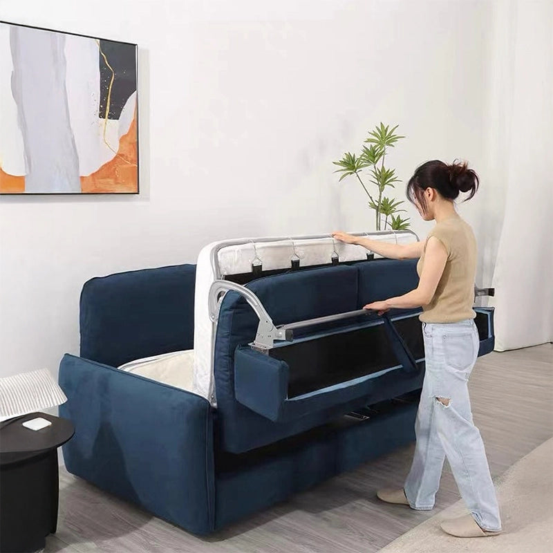 Side profile picture with flared arms, couch sleeper + sofa bed design, compact frame, blue tone