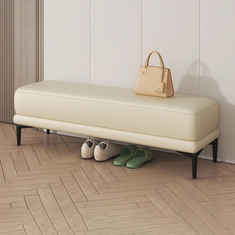 Black-legged designer bench ottoman with plush seat and Scandinavian frame detail