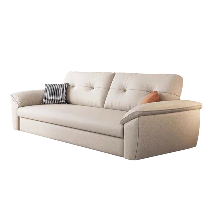 Compact sofa bed couch in rectilinear shape with soft neutral fabric