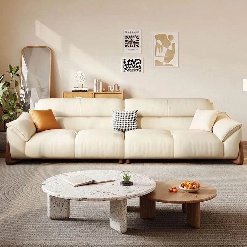 Teardrop wooden legs and smooth leather texture – latest sofa design, buy couch online, cream