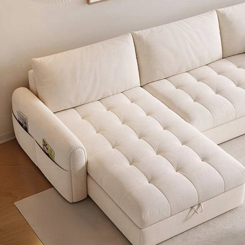 Rounded arm sofa sleeper with fabric handles and side pockets in beige upholstery
