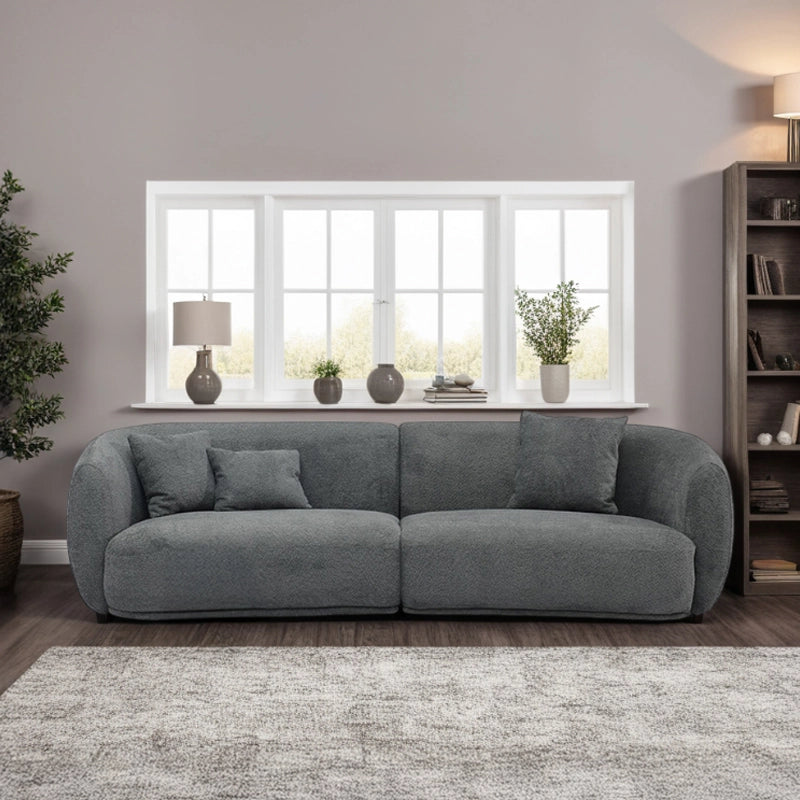 This three-seater couch combines plush texture and ergonomic form in a Scandinavian-inspired silhouette. 