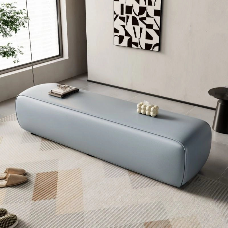 This modern upholstered bench delivers both function and form through a seamless rectangular design with rounded corners and a low-profile frame