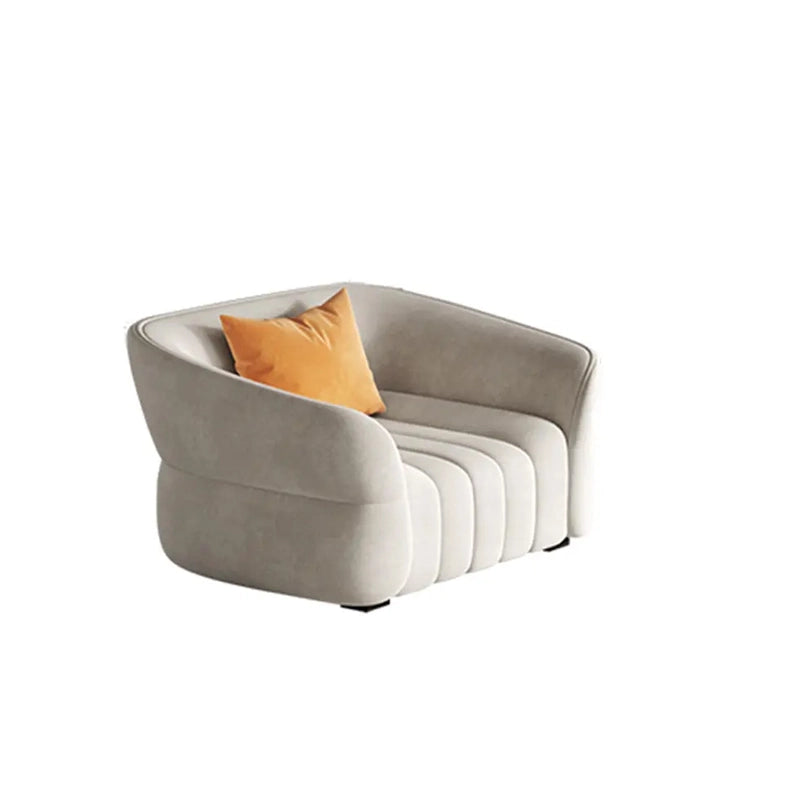 Designed with vertical channeled tufting and cocoon-like arms, this fabric sofa offers a blend of sculptural aesthetics and deep-seated comfort.