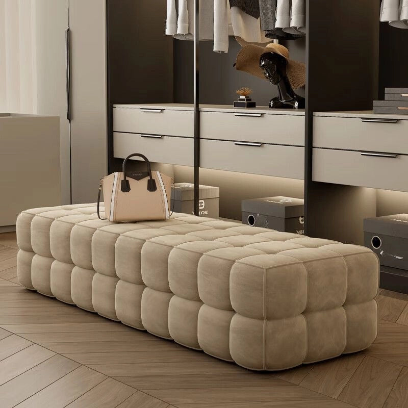 With its rectangular, legless profile and generously cushioned seat, it serves beautifully as a bed bench or decorative bench ottoman in luxe dressing rooms.