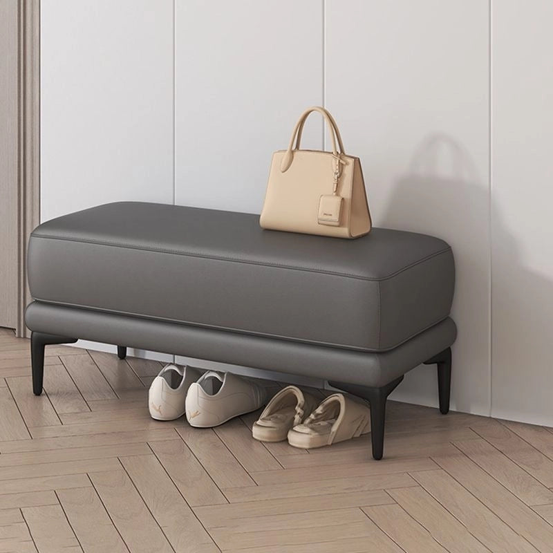 Grey storage bench ottoman featuring clean lines and floating silhouette look