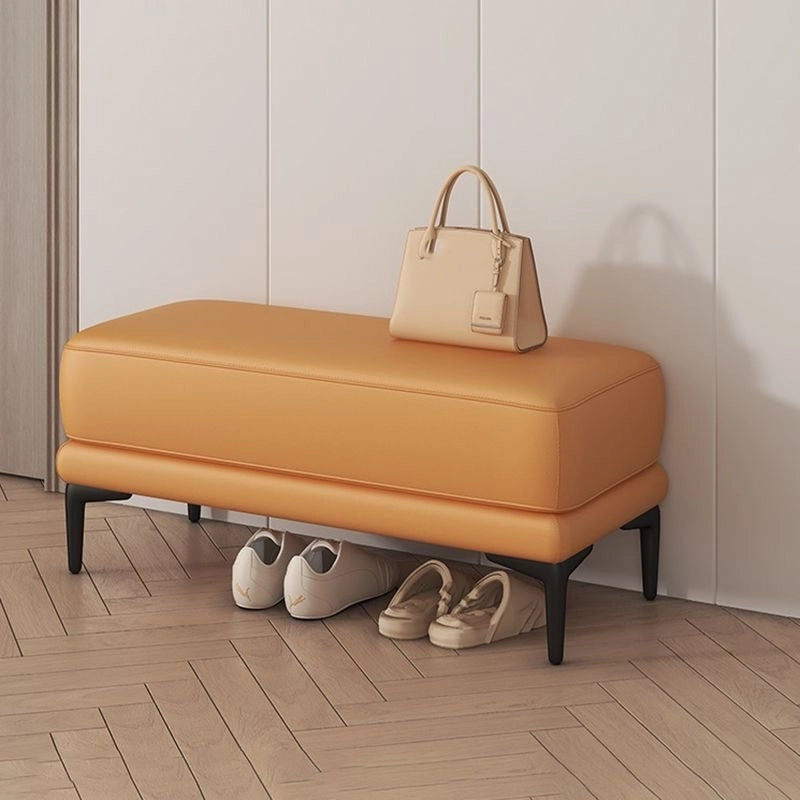 With clean lines, minimal stitching, and faux leather finishes in tan, it fits seamlessly into entryways, bedrooms, or lounge nooks