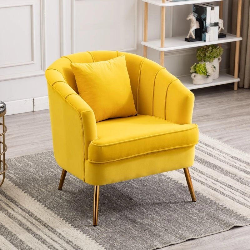 This contemporary lounge armchair is crafted with a barrel-shaped back, flared arms, and a sleek gold metal base, offering both comfort and style for Indian homes