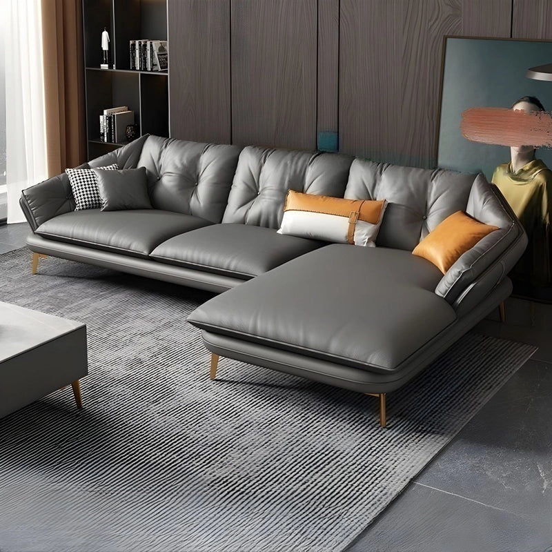 Front view of sleek leatherette and pure leather couch and design sofa design – soft seat edges and slim legs