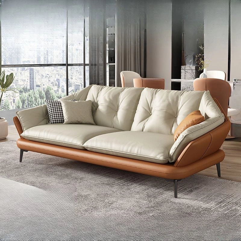 Its L configuration and right-hand chaise layout offer generous seating space, while the dual-tone faux leather finish in cream, grey, or tan tones adds refined style.