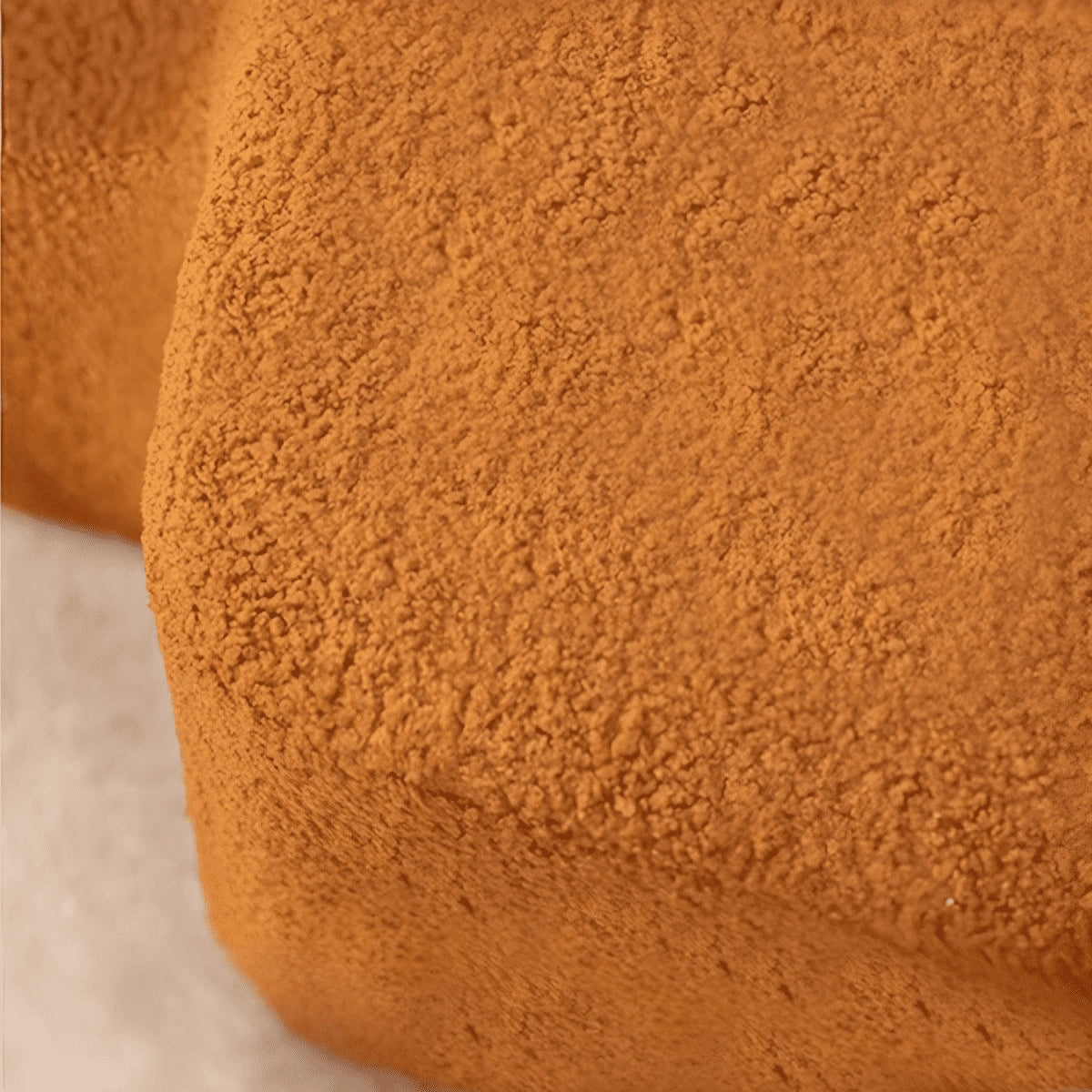 The Vela Ottoman by Kate and Mark redefines soft geometry in upholstered furniture