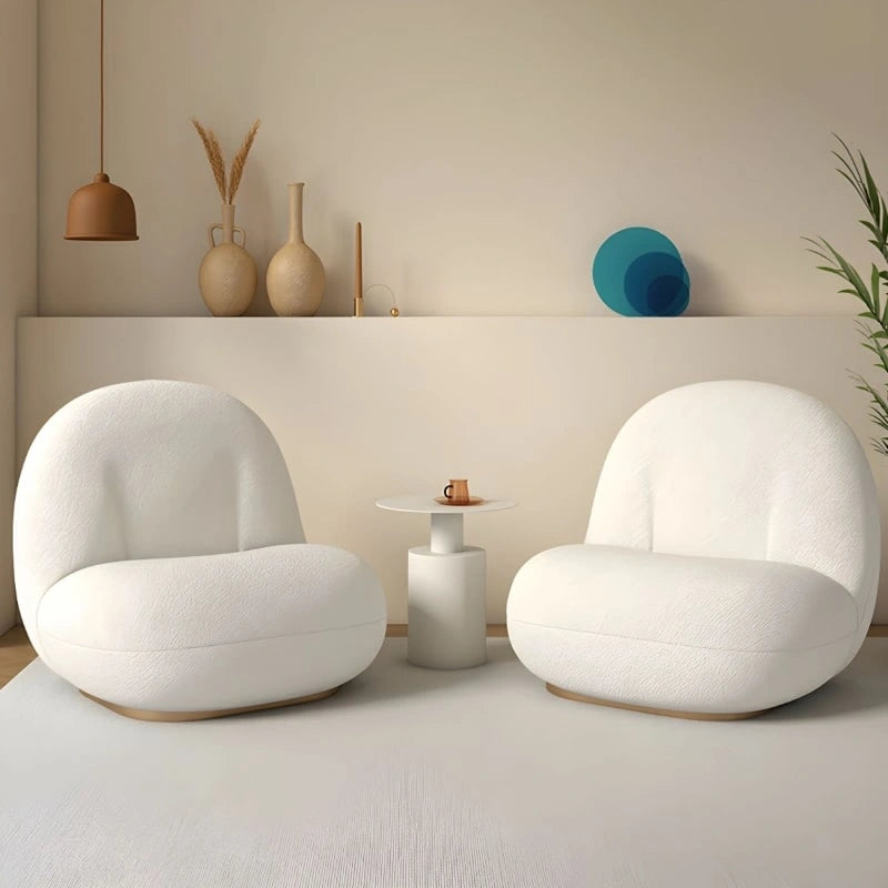 minimal reading armchair with smooth curves | one seater sofa chair | fabric upholstery