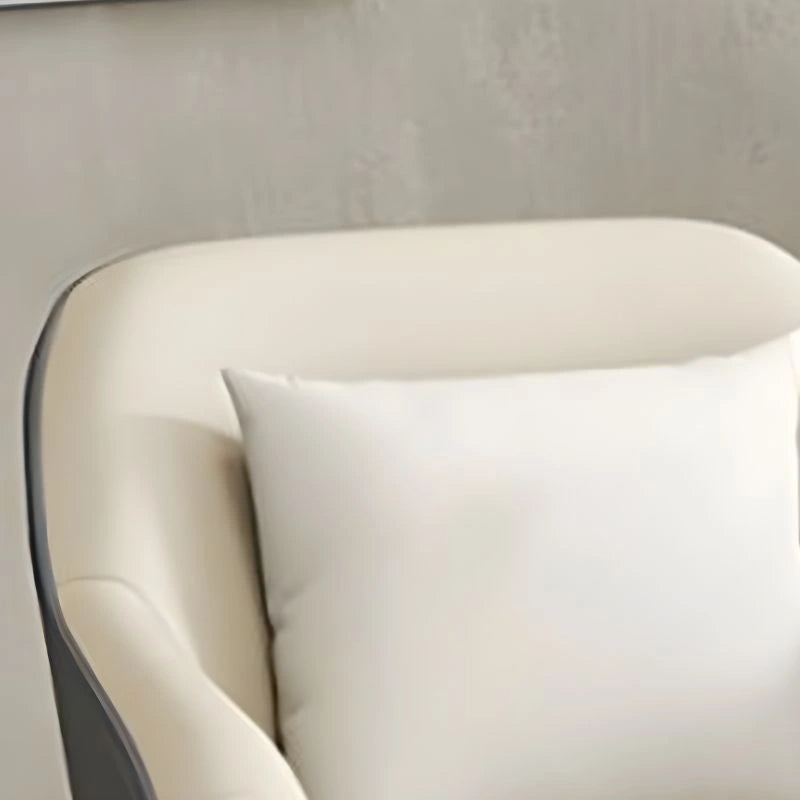 The Unola accent chair is a modern lounge room chair crafted with a chic barrel shape and shelter-style arms.