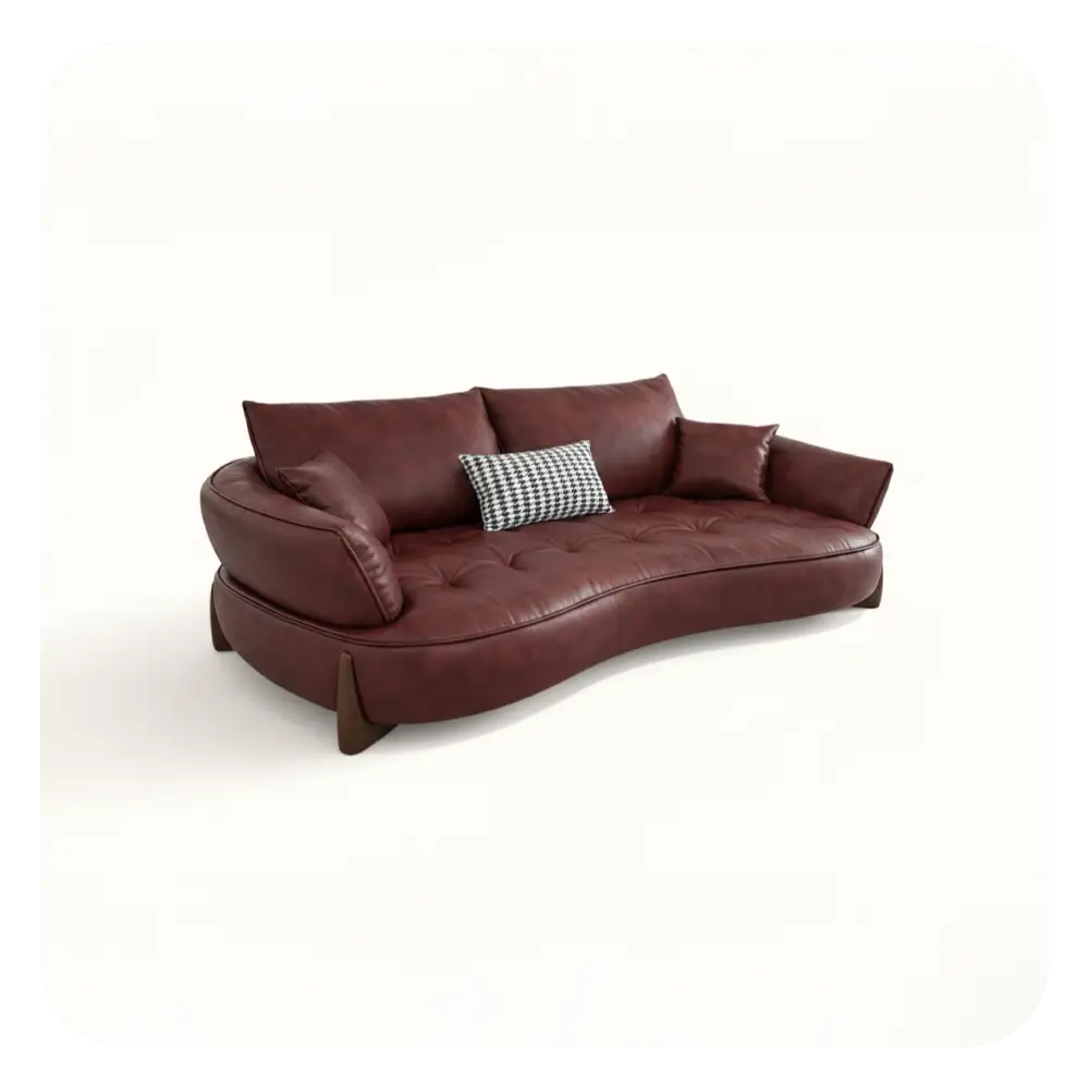 Brown leather sofa with a decorative pillow on a white background
