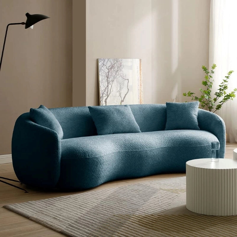 Wellington luxury couch with organic bean shape silhouette, designer couch styling, boucle fabric texture, and 3 seater sofa comfort for modern living spaces.